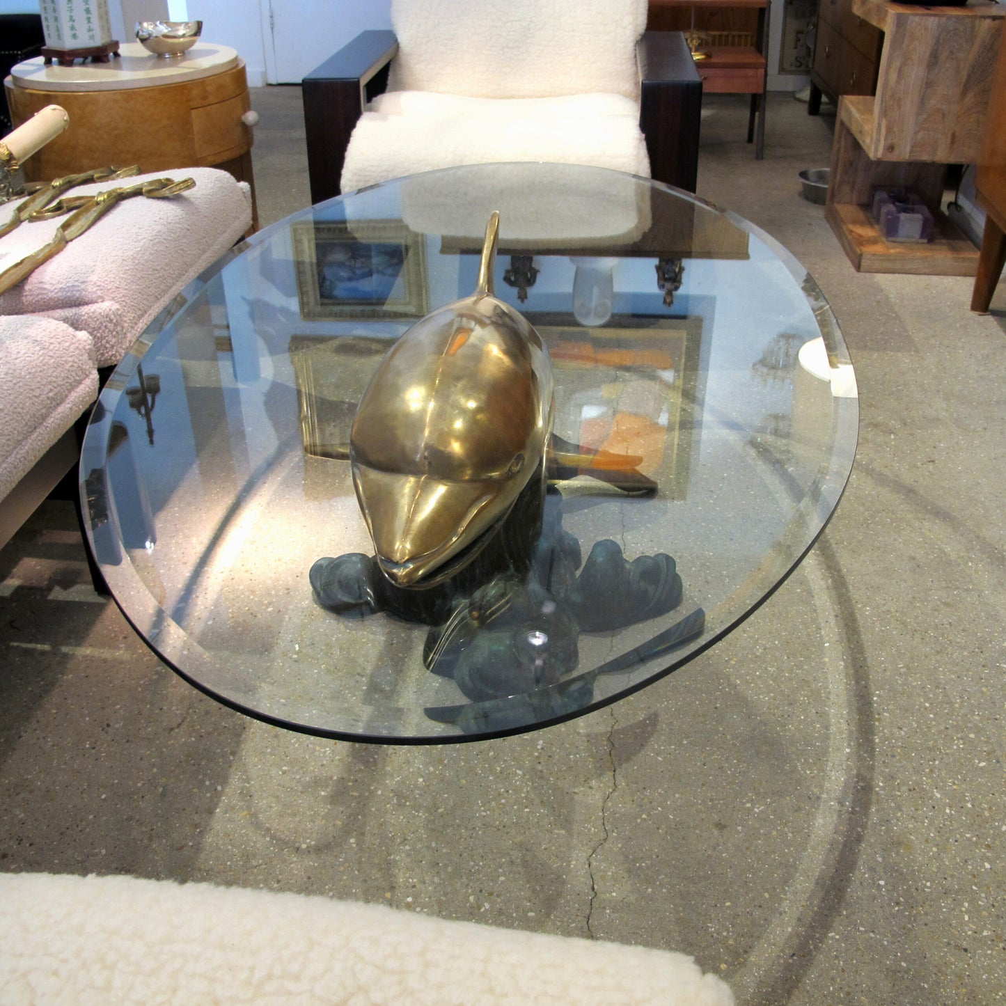 1960s French Brass Coffee Table in the shape of a Dolphin with an Oval Glass Top