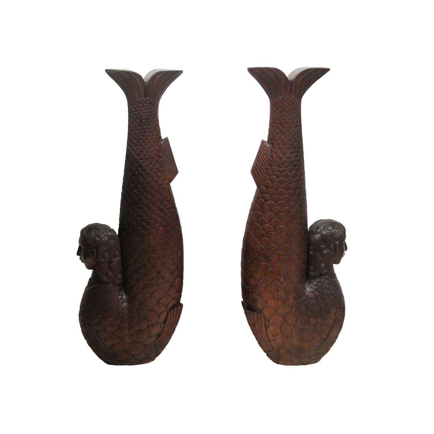 A pair of carved wood mermaids