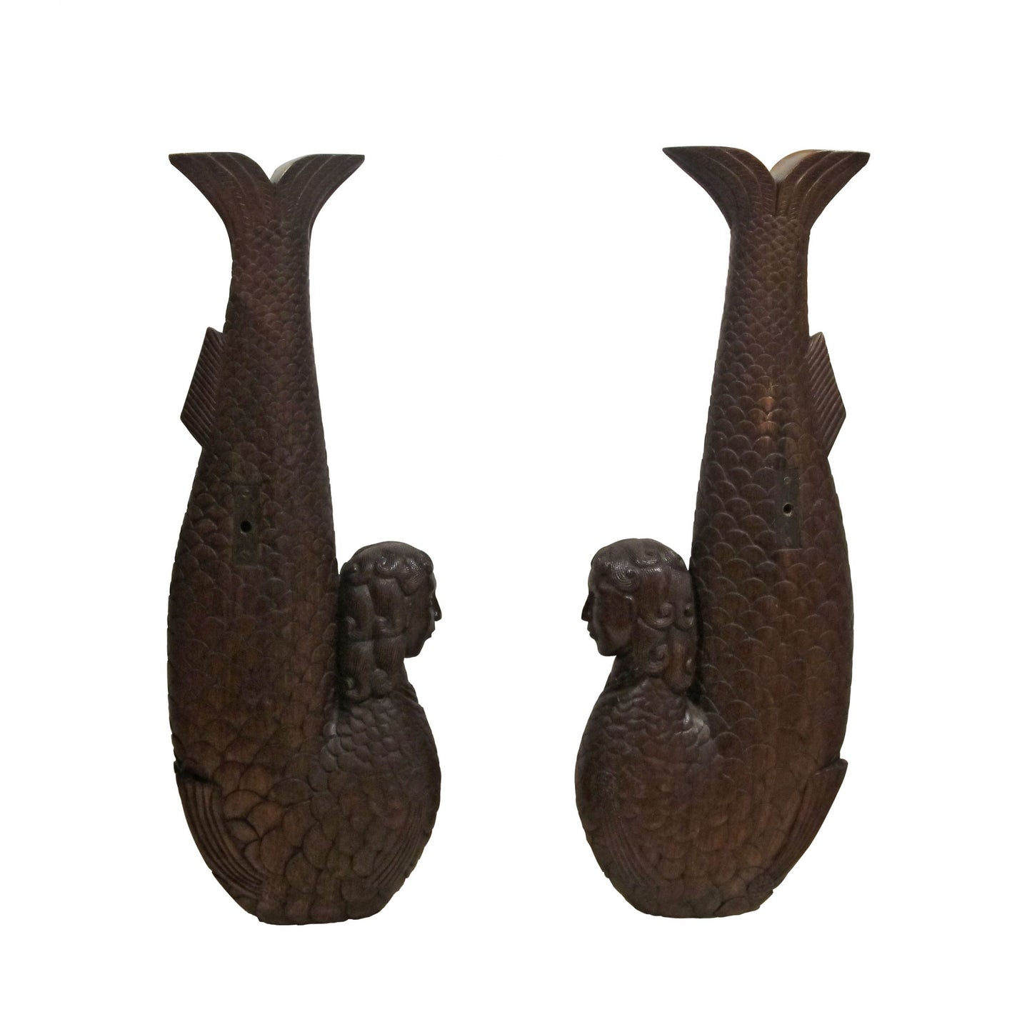 A pair of carved wood mermaids