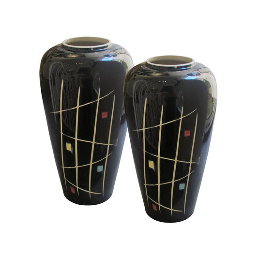 A pair of tall mid century glazed ceramic vases